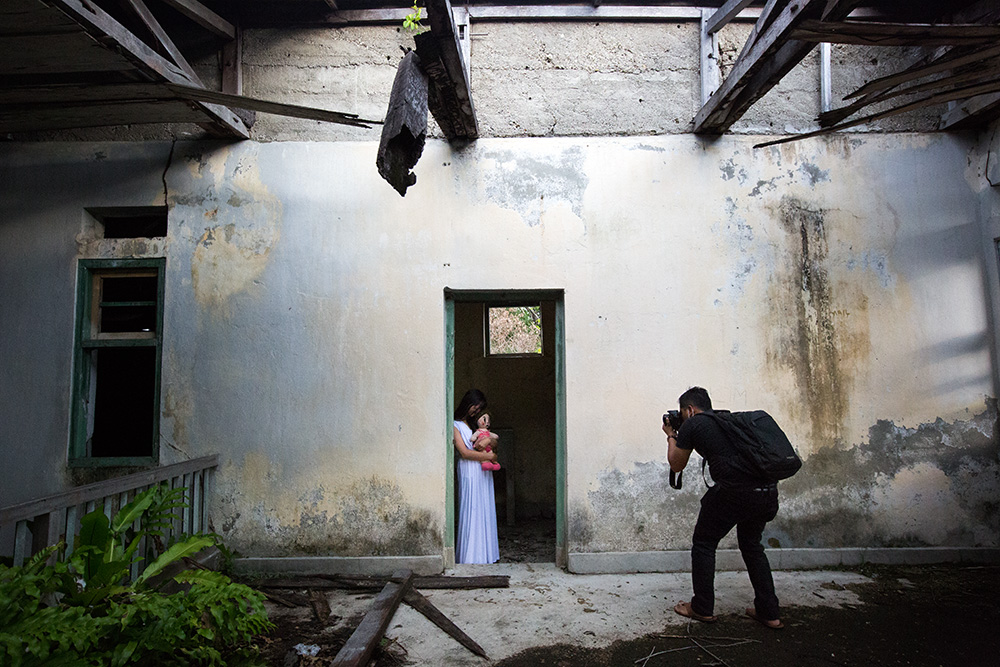 Poso. Amateur collective group practice their photography skills in an old colonial Dutch building devastated during the conflict.