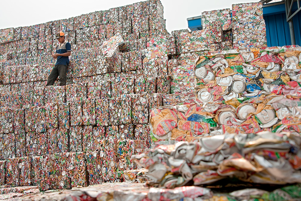 Blocks of pressed aluminium cans in a large waste warehouse and processing factory in Phnom Penh.