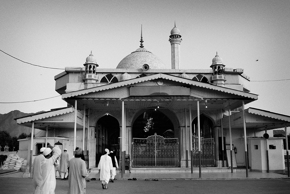 Muslims head to a mosque in Srinagar for evening prays.